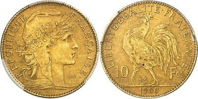a gold coin with an image of a woman and a rooster on it