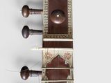 a close up of a musical instrument on a white surface
