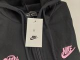 a black hoodie with a pink nike logo on it