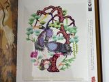 a picture of a book with a picture of a tree and birds on it