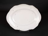 an image of a white plate sitting on top of a black table