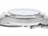 a close up of a watch on a white surface