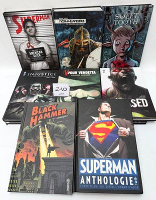 a lot of comic books that are on the table