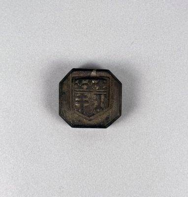 an old coin with a coat of arms on it