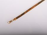 an image of a wooden stick with a metal handle on a white surface