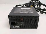 a close up of a power supply unit on a white surface