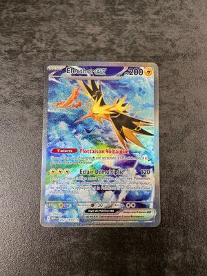 a close up of a pokemon card on a table