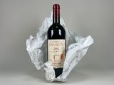 a bottle of wine that is sitting in a bag