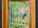 une peinture à l'huile représentant une scène forestière, dans un cadre doré