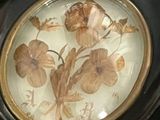 a clock with a picture of a flower on it