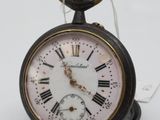 a black and white clock with roman numerals on it