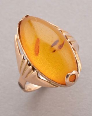 an image of a ring with a yellow stone in it