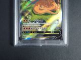 a close up of a pokemon card in a plastic case
