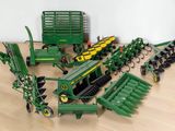 a lot of toy farm equipment on the floor