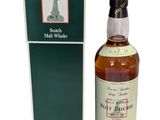 a bottle of pott dhubh scotch whisky next to a box