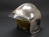 silver helmet on a black background with a black background