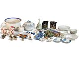 many different types of pottery on display on the table