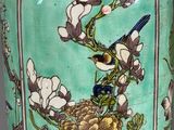 a green vase with a bird and flowers on it