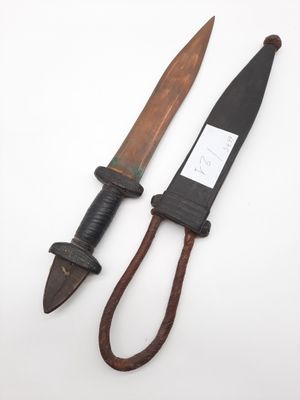 two old knives are sitting next to each other on a white surface