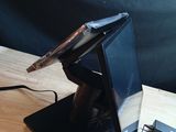 a laptop computer sitting on top of a wooden table