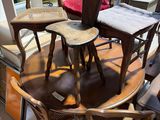 several chairs and a table in a room with a lot of windows