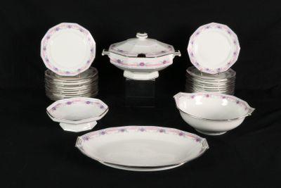 a lot of plates and bowls on a black table