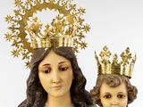 an image of a statue of the virgin and child with a crown