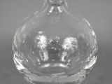 a clear glass bottle with an elephant inside of it