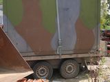 a large truck that is parked next to a pile of bricks
