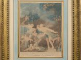 a framed picture of a painting of a woman and two children