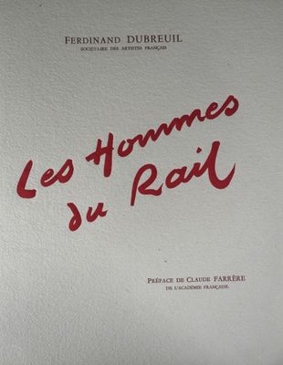 un gros plan d'un livre sur lequel figurent des inscriptions en rouge