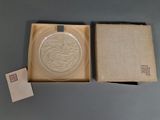 a glass plate in a box on a table