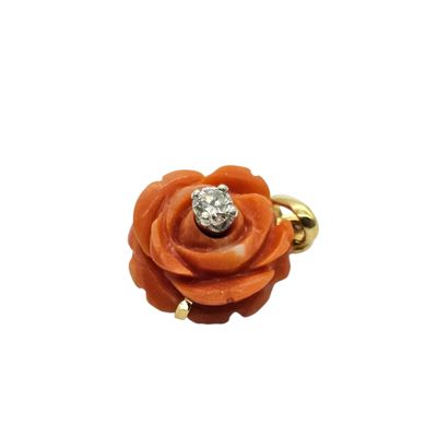 an image of an orange rose with a diamond in the center