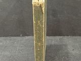 an old book with a hole in the middle of it