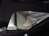 a view of the inside of a car from the driver ' s seat