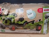 a box with a toy tractor in it sitting on a table