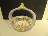 a small bowl with a handle on a table