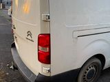 a white van that is parked in a parking lot