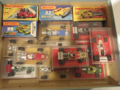 a lot of toy cars in a box on the table
