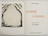 an open book with a black and white drawing on it