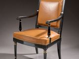 a black and brown chair with leather upholstered seat