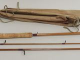 two fishing rods and a bag on the table