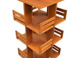 an image of a tall wooden shelf with drawers on top of it