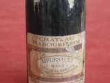 a bottle of wine that is sitting on a table