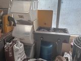 a kitchen with a lot of clutter on the floor