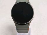 a smart watch sitting on top of a clear stand