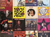 a lot of records on the wall of a room