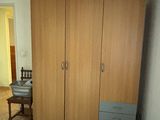 a bedroom with a bed and a closet in it