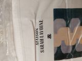 a white shirt with a picture of a flower on it