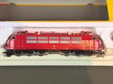 a red train on the tracks in a box